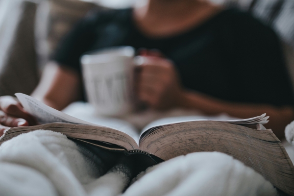 Reading with cup of coffee