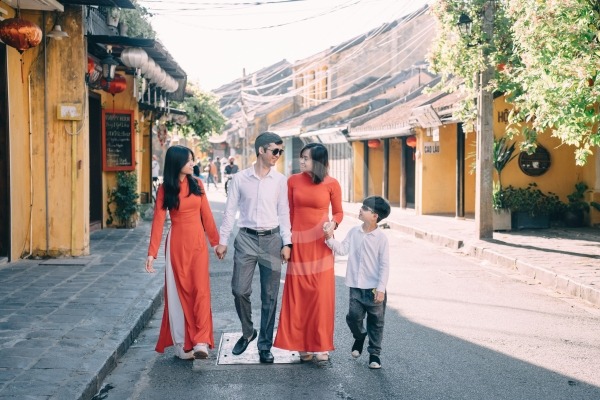 A group of people walking down a street